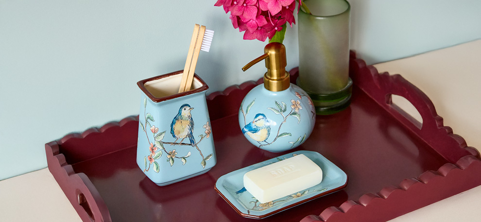 A tray with Carolyn Donnelly Eclectic Bathroom items.